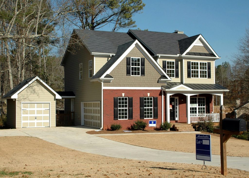 pexels-photo-164522-164522 Beautiful two-story home with garage in a serene neighborhood, perfect for families.