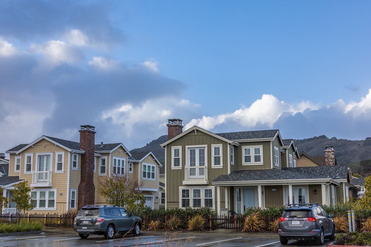 Suburban homes in a neighborhood like those in Apex vs Holly Springs, NC