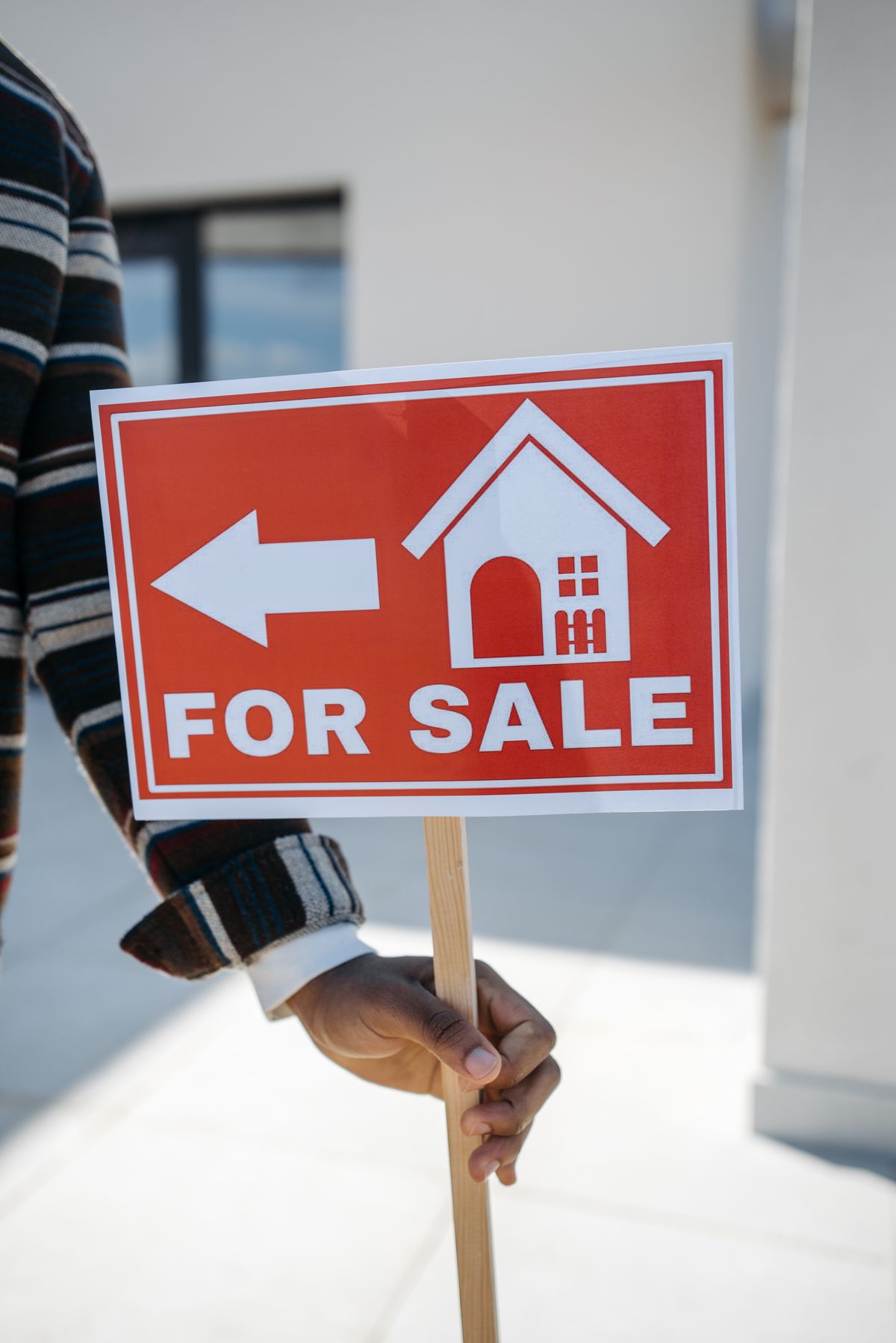 Cary housing market home for sale sign in front of a single-story house