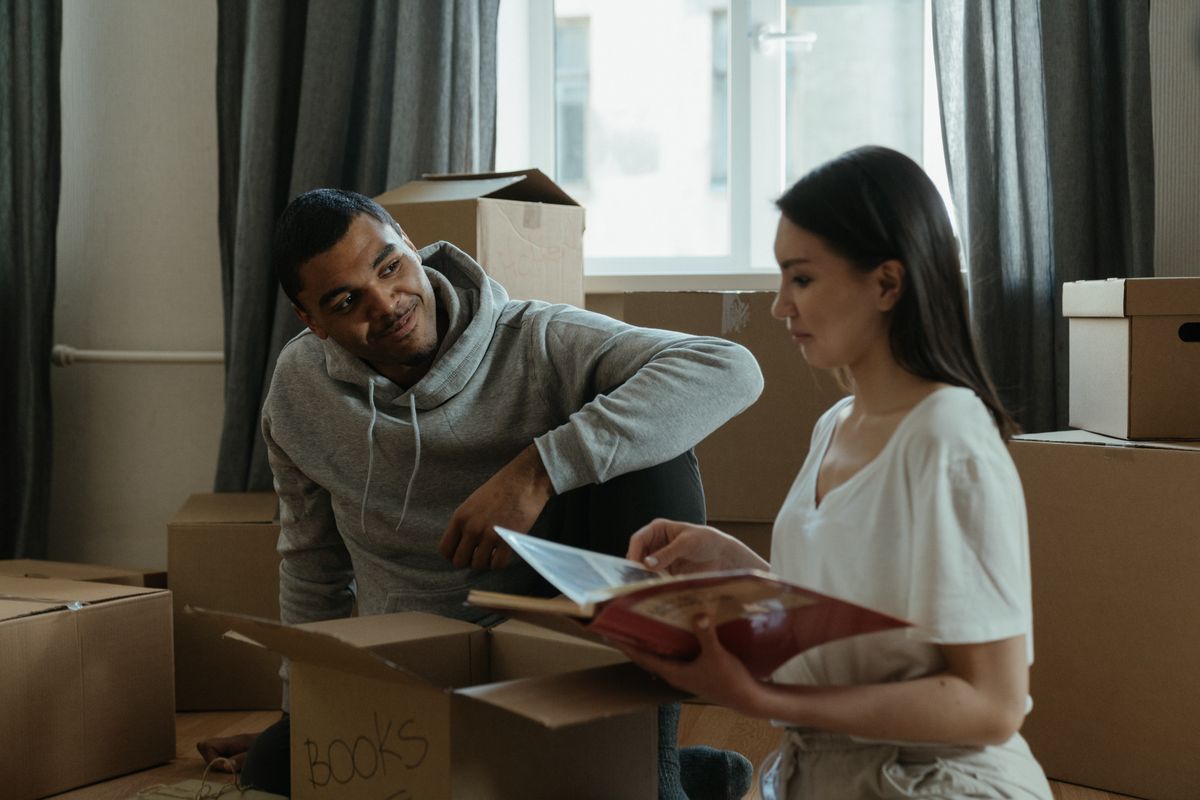 Couple unpacking boxes after moving to Cary NC