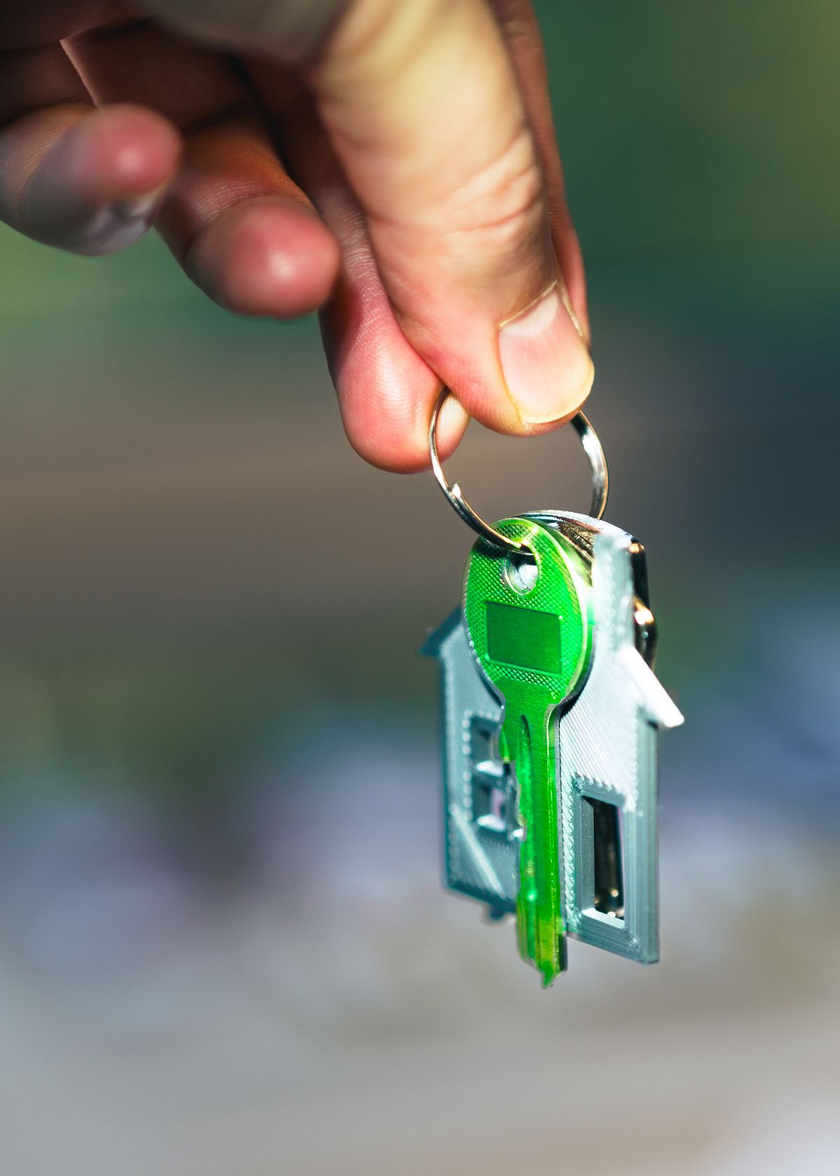 Hand holding house keys, representing NC first-time homebuyer programs